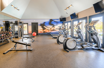 Resident gym with cardio and weight equipment 